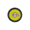Top view of a high-power LED flashlight head showing the yellow reflector plate, central LED chip, and secondary optics.