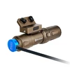 Bronze Olight weapon light with mount, charging via blue magnetic cable.