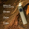 Olight green flat flashlight shining on mossy tree bark showing battery life specifications