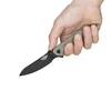 Hand holding an OKNIFE EDC folding knife, black blade, green textured handle.