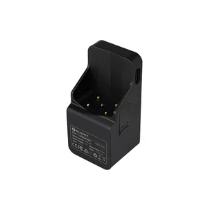 Olight Oclip 2 black charging dock showing USB-C port and golden pogo pin connectors on white background