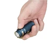 Olight Dark Blue Baton 4 Premium flashlight held in hand, showing textured grip, gold accents, and pocket clip for EDC.