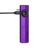 Purple Olight Arkfeld Pro flat flashlight charging with USB-C cable showing battery indicator ring and laser switch.