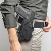 Olight Black gun holster side view on belt for EDC secure personal carry.