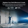 Warrior Ultra tactical flashlight projecting 2500 lumens and 320 meters beam on an outdoor building wall at night