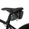 Gray bicycle saddle bag attached to a black bike seat, offering convenient storage for cycling essentials.