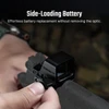 Olight Black Osight C red dot sight, side view of hand opening the side-loading battery compartment, for tactical use.