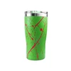 Green stainless steel insulated travel tumbler with red paint splatter design and clear lid isolated on white background