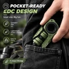 Green GoBigger pocket-sized EDC fidget toy being pulled out of a black jeans pocket, showing its compact design.