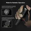 Gloved hand holding a flashlight, close-ups of its textured tail button and hexagonal side button for reliable operation.