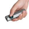 Olight two-tone gray ArkPro Lite multi-function work light in hand, button pressed, for versatile utility.