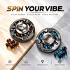 Two premium metal fidget spinners with engraved patterns, amber and blue marbles for stress relief and smooth spinning.