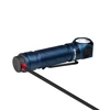 Blue Olight right-angle flashlight being charged by its magnetic cable.