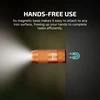 Orange imini 2 magnetic flashlight attached to a surface, providing hands-free illumination.