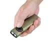 OLIGHT Arkfeld Ultra olive green flashlight, held in hand, for everyday carry and outdoor use.