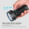 Olight Black Marauder Mini Flashlight, hand operating rotary switch to demonstrate smart lockout and easy unlocking.