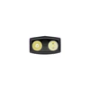 Close-up view of a dual-LED headlamp lens showing spotlight and floodlight beams on a white background