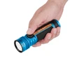 Olight Blue Seeker 4 Pro tactical flashlight held in hand, showcasing rotary side switch and textured grip for outdoor illumination.