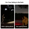 Olight Oclip Pro white and red lighting modes for night hiking and outdoor safety by a lake.