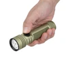 Hand holding olive green Olight Seeker Ultra tactical flashlight isolated on white background
