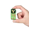 Olight Green Oclip Pro S held in hand, with red blood splatter design, showcasing compact size and clip-on versatility.
