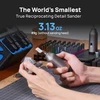 Hand holding the world's smallest reciprocating detail sander weighing 3.13 oz to sand a miniature model.