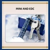 Olight i3E EOS blue pattern mini EDC keychain flashlight with keys next to a decorative porcelain gift box