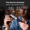 HOZO NeoBlade feather-light ultrasonic cutter held by a creator showing its compact size and lightweight design