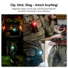 Olight Oclip Pro multi-functional portable light with magnetic base for versatile mounting, used for outdoor lighting and work.