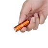 Olight orange I1R 2 Pro EOS held in hand, a tiny powerful LED light for everyday carry.
