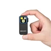 Olight Black Oclip Pro Clip-on Light Held in Hand Showing Ultra-Compact EDC Flashlight Design for Everyday Carry