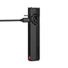 Olight Arkfeld Pro flat flashlight in black charging via USB-C cable on a white background