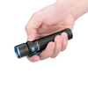 Olight Black Warrior Mini 2 Flashlight in hand with side switch and blue pocket clip for everyday carry