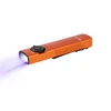 Olight Arkfeld UV, flat orange EDC flashlight with white and ultraviolet light, isolated on white.
