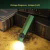 Vintage green flashlight shining on an old map, with antique books and wooden boxes.