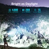 Olight Seeker 4 Pro flashlight illuminating a vast dark mountain landscape for night hiking and outdoor exploration.