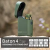 Olight olive green Baton 4 Premium Edition 1300 lumen flashlight in its open wireless charging case for outdoor use.