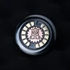 Mechanical EDC haptic coin with bronze owl emblem and gold gear details on black background