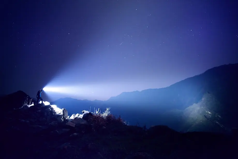 High lumen flashlight illuminates mountains over long distances