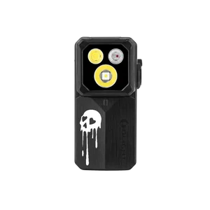 Olight black compact clip light with melting skull design and three LED lenses isolated on black background