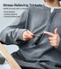 Person playing with a stress-relieving ratchet toy on a black phone case for ASMR sounds and anxiety relief.
