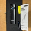 Olight Arkfeld UV flashlight in box with user manual.