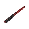 Red and black tactical penlight with integrated laser pointer and ballpoint pen on white background