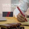 Person writing with a red Olight OPen 3 pen, showcasing its textured grip for comfortable and secure holding.