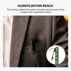 Green pen with spring-loaded clip in suit pocket, ready for use.