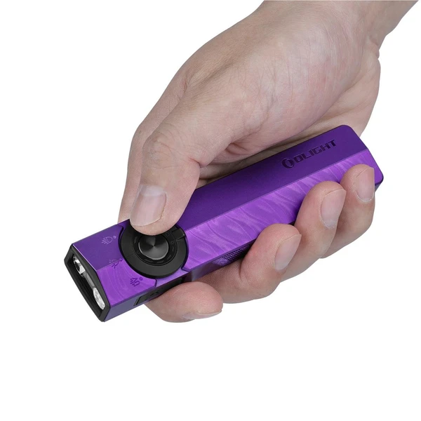 Olight Purple ArkPro Flat Flashlight held in hand showing selector dial and textured grip for everyday carry and outdoor use