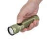 Hand holding Olight Seeker Ultra OD green tactical flashlight isolated on white background