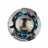 Modern round metallic sculpture with gold wave patterns, engraved silver base, and blue glass spheres on white background