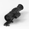 Black tactical thermal rifle scope with laser rangefinder and Picatinny mount isolated on white background